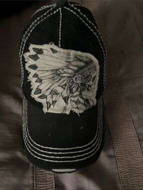 Black Baseball Cap with Distressed Feathered Skull Patch